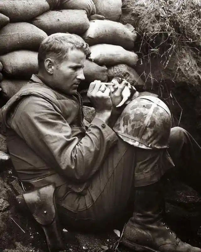 A Soldier Attends to a Kitten