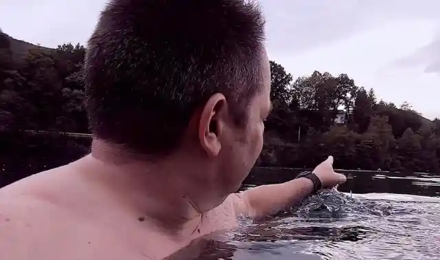 Man In Water Feels Something Hit His Leg, Then Sees Tiny Foot Pop Up