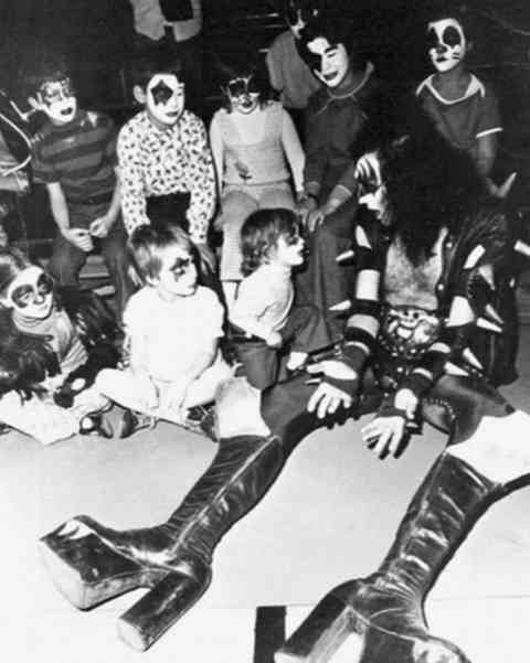 Gene Simmons spending time with young KISS fans in the 1970s