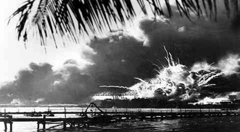 38. Destroyer USS Shaw exploding during the Japanese attack on Pearl Harbor, December 7, 1941.
