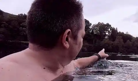 Man In Water Feels Something Hit His Leg, Then Sees Tiny Foot Pop Up